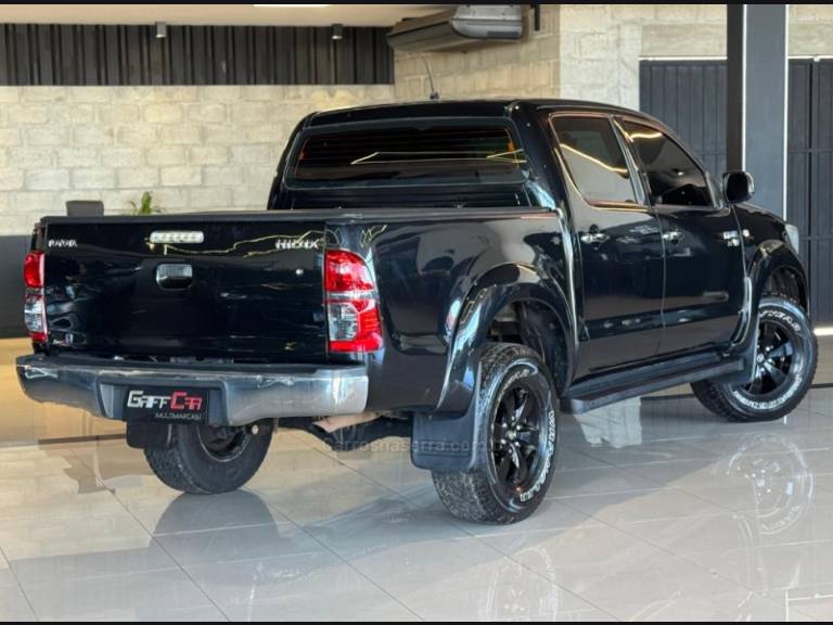 TOYOTA - HILUX - 2011/2012 - Preta - R$ 89.900,00